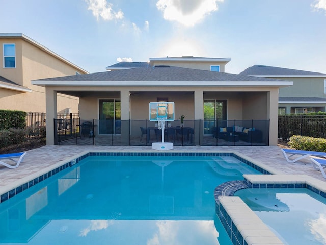 view of pool featuring an in ground hot tub and a patio