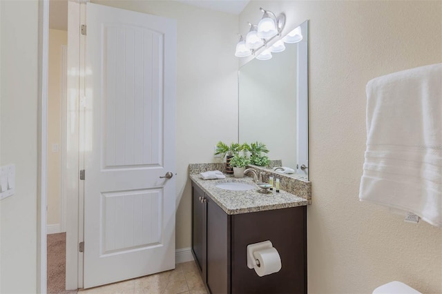 bathroom with tile floors and vanity