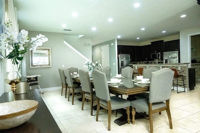 dining space with light tile floors