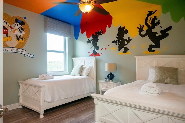 bedroom with ceiling fan and dark wood-type flooring