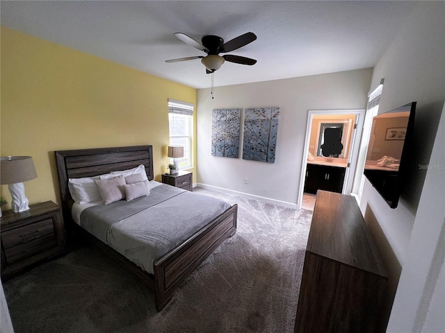 carpeted bedroom with connected bathroom and ceiling fan