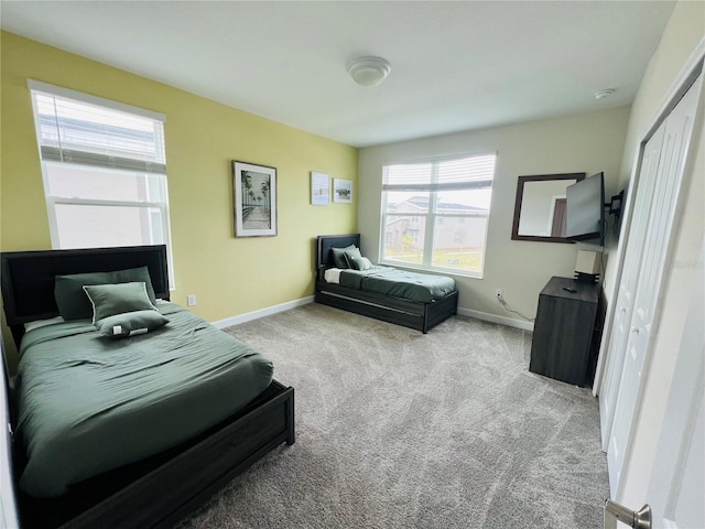 carpeted bedroom with a closet