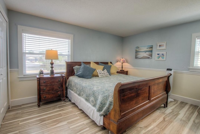 bedroom with a closet and light wood-type flooring