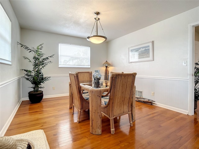 dining area with light wood-type flooring