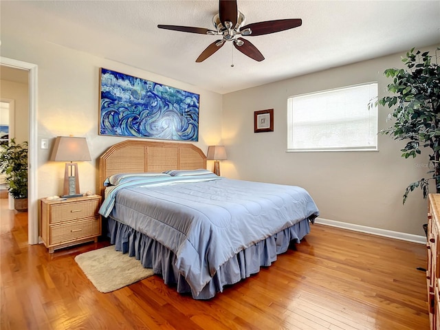 bedroom featuring ceiling fan and light hardwood / wood-style flooring