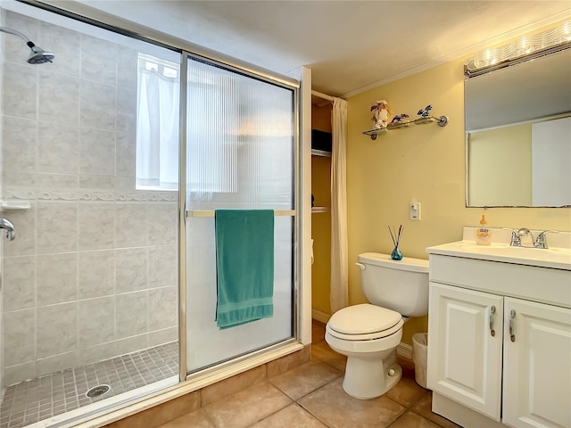 bathroom featuring an enclosed shower, tile flooring, oversized vanity, and toilet