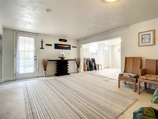 living area with a textured ceiling