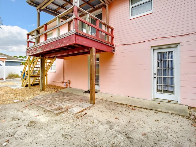 back of house with a balcony and a patio area