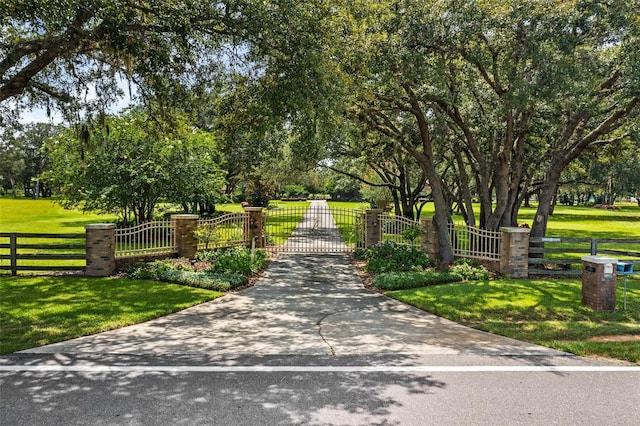 view of property's community with a yard