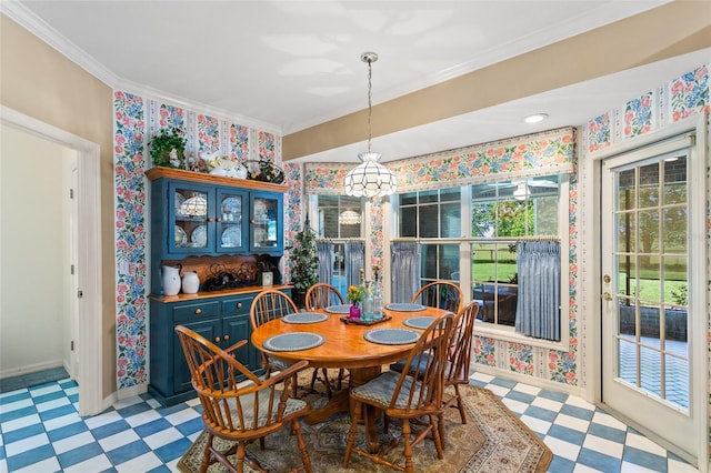 tiled dining area featuring plenty of natural light and ornamental molding