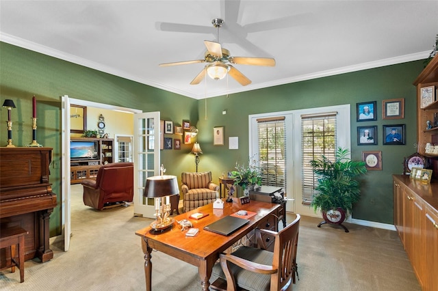 carpeted dining area featuring ceiling fan, french doors, and ornamental molding