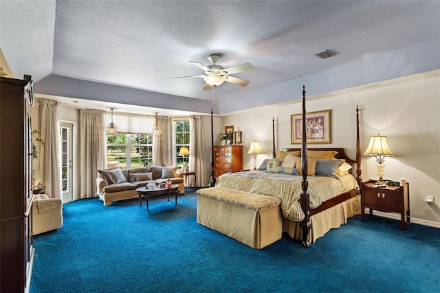 bedroom featuring a textured ceiling, dark carpet, ceiling fan, and vaulted ceiling