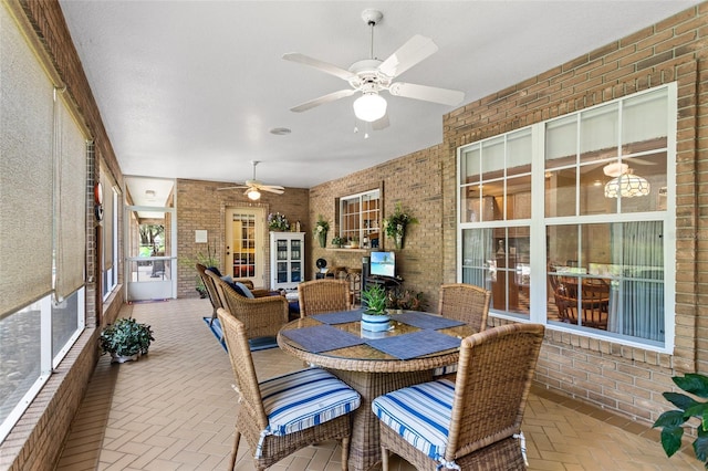 sunroom / solarium with ceiling fan