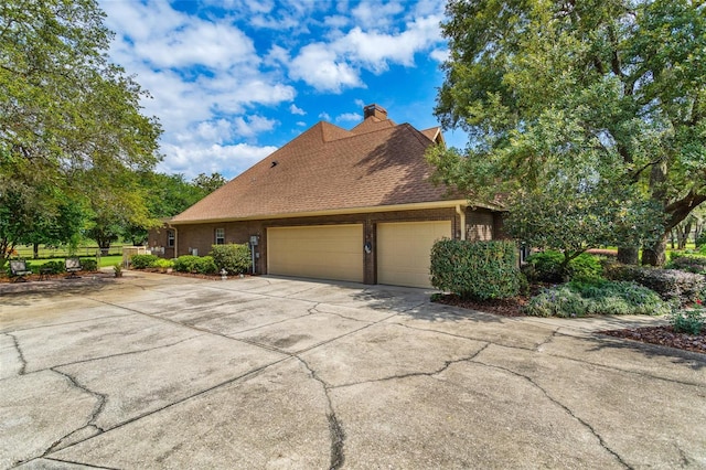 view of side of property featuring a garage