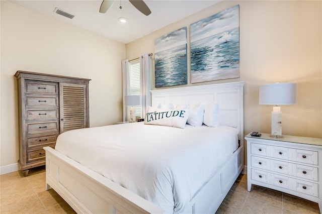 tiled bedroom featuring ceiling fan