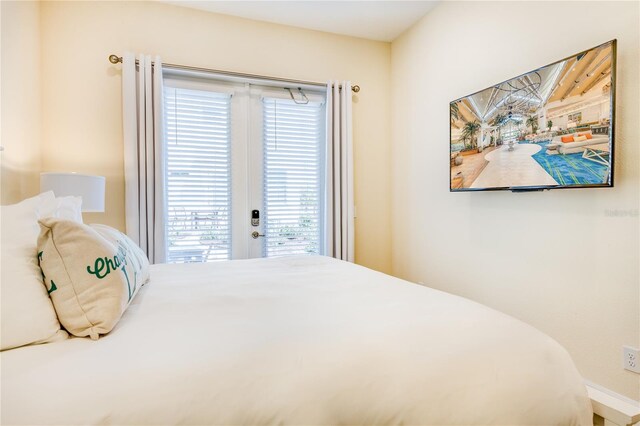 bedroom featuring access to exterior and french doors