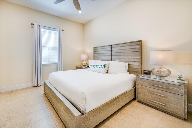 tiled bedroom with ceiling fan