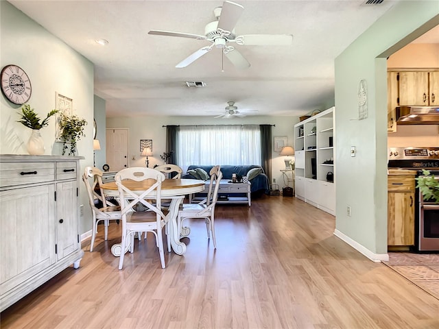 dining room featuring ceiling fan and light wood-type flooring