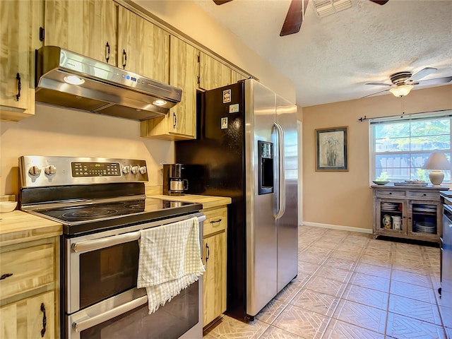 kitchen featuring appliances with stainless steel finishes, a textured ceiling, ceiling fan, and light tile flooring