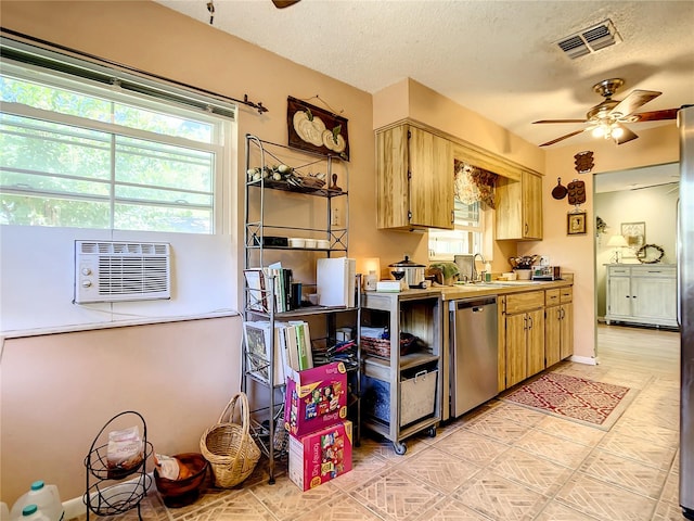 kitchen featuring a textured ceiling, sink, ceiling fan, and dishwasher