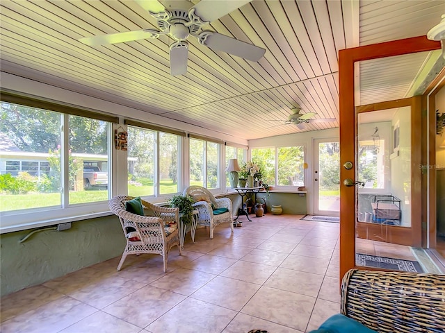 sunroom with ceiling fan and a wealth of natural light