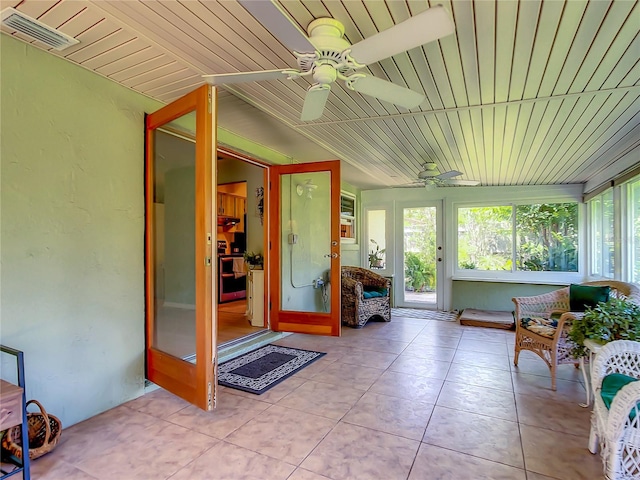 sunroom with wood ceiling and ceiling fan