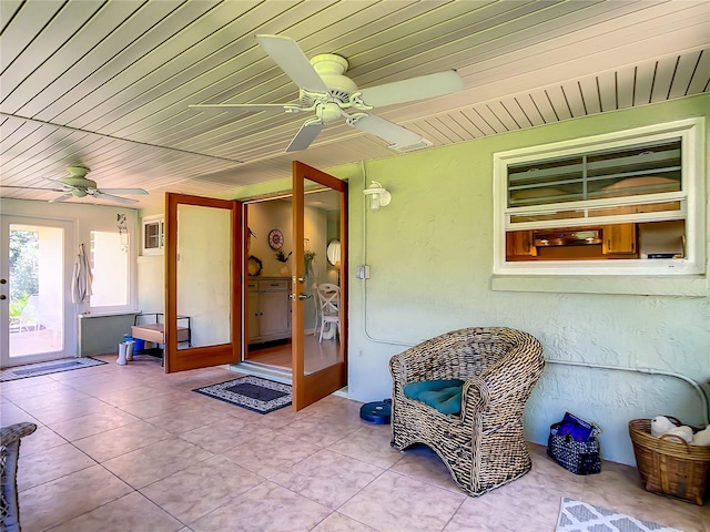 interior space with ceiling fan