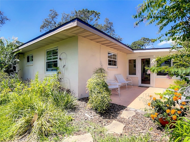 rear view of house with a patio area