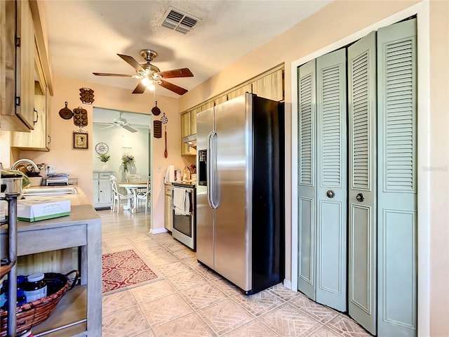966 N Ronald Reagan Blvd, Longwood, FL 32750 - kitchen featuring stainless steel appliances, ceiling fan, a sink, light tile patterned floors, and light brown cabinetry