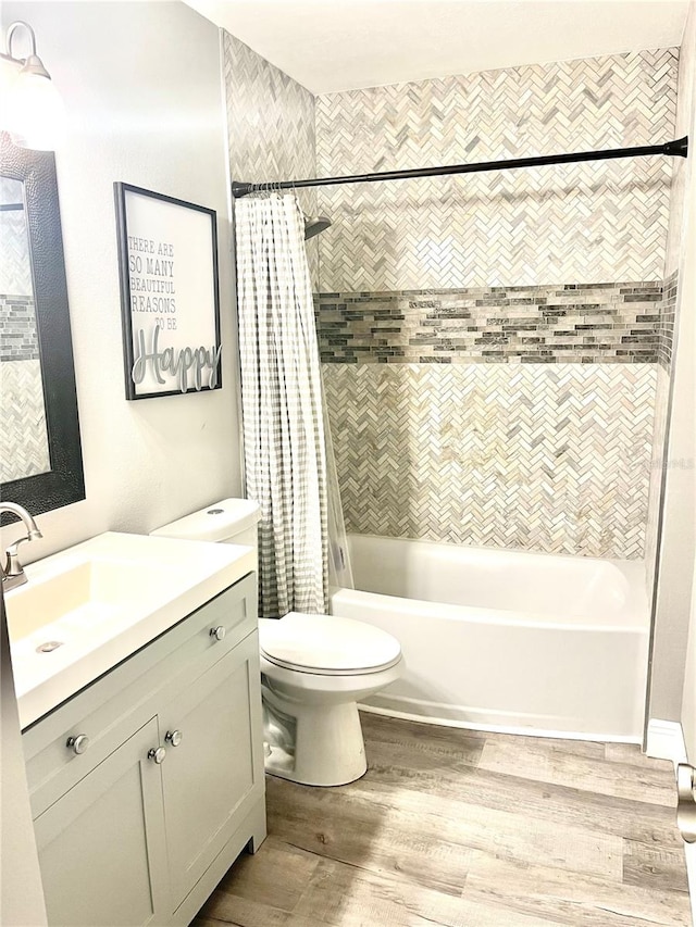 full bathroom with shower / bath combination with curtain, toilet, oversized vanity, and hardwood / wood-style flooring