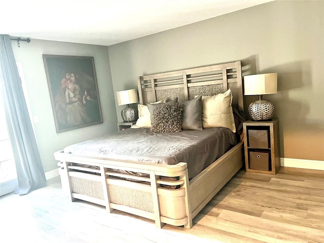 bedroom with light hardwood / wood-style floors