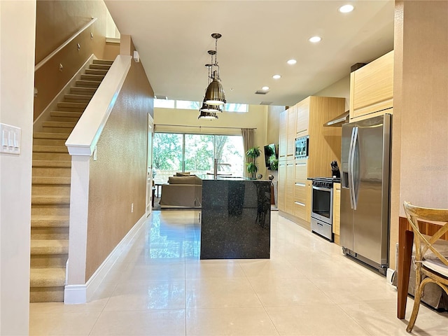 kitchen featuring light tile floors, hanging light fixtures, stainless steel appliances, an inviting chandelier, and light brown cabinets