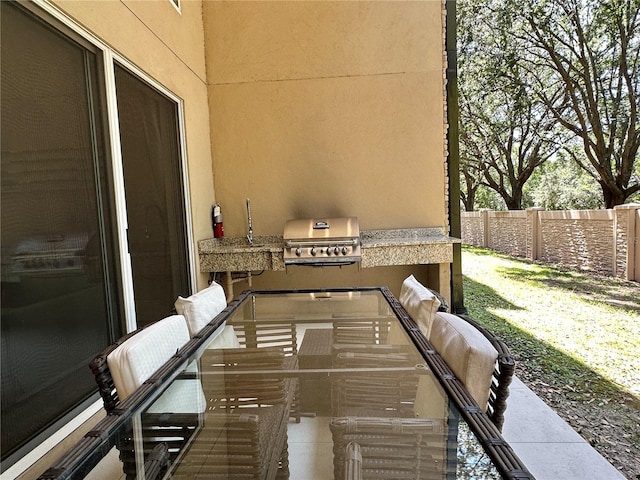 view of patio featuring grilling area and exterior kitchen