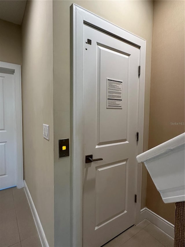 interior space featuring light tile floors