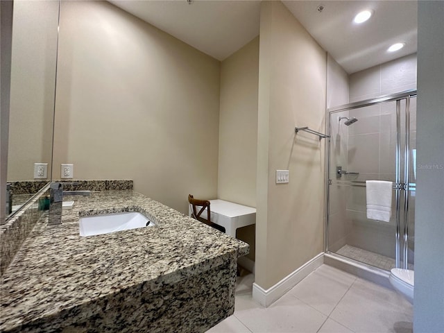 bathroom with an enclosed shower, toilet, tile floors, and vanity