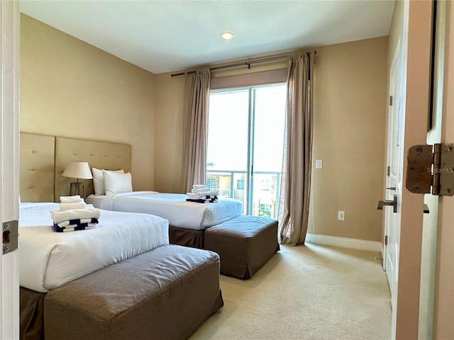 carpeted bedroom featuring multiple windows