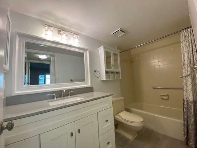 full bathroom featuring toilet, shower / bath combo, and vanity