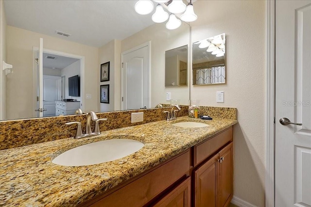 bathroom featuring dual vanity