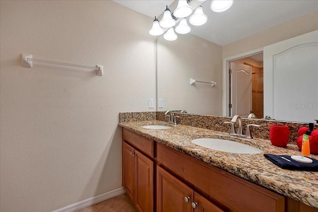 bathroom with tile floors and double vanity