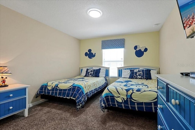 carpeted bedroom featuring a textured ceiling