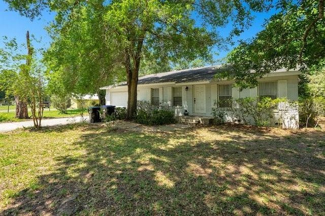 exterior space with covered porch and a front lawn