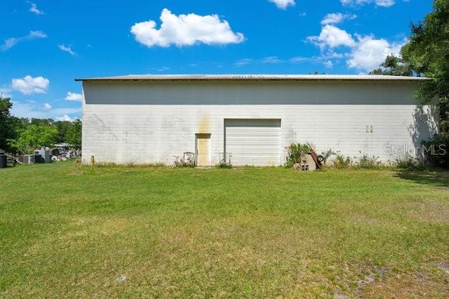 garage with a yard