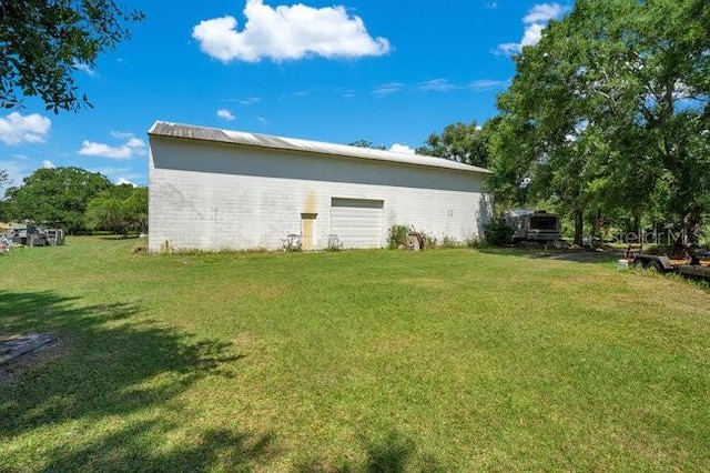 rear view of property with a lawn