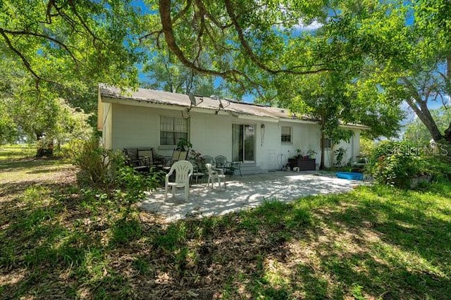 back of house featuring a patio area