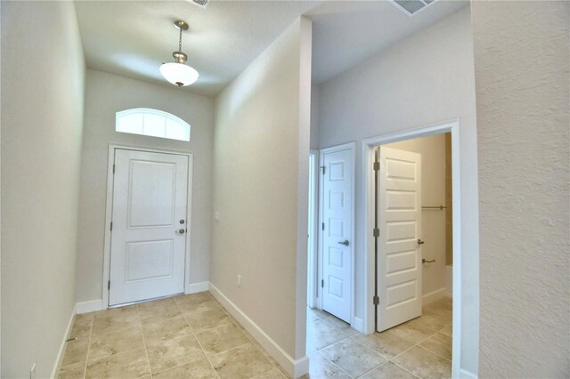 entrance foyer with light tile patterned flooring