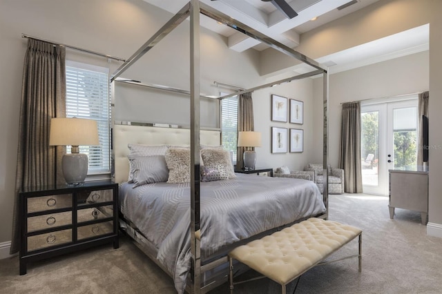 bedroom featuring access to outside, beamed ceiling, carpet flooring, ornamental molding, and french doors