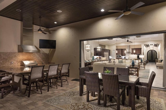 dining area with wood ceiling, ceiling fan, and high vaulted ceiling