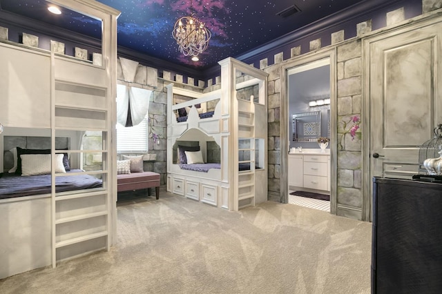 bedroom featuring ensuite bath, carpet floors, and crown molding