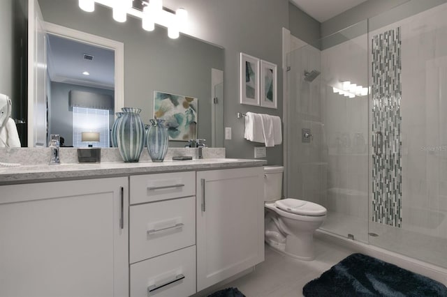 bathroom featuring a shower with door, vanity, and toilet