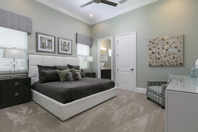 carpeted bedroom featuring multiple windows, connected bathroom, ornamental molding, and ceiling fan